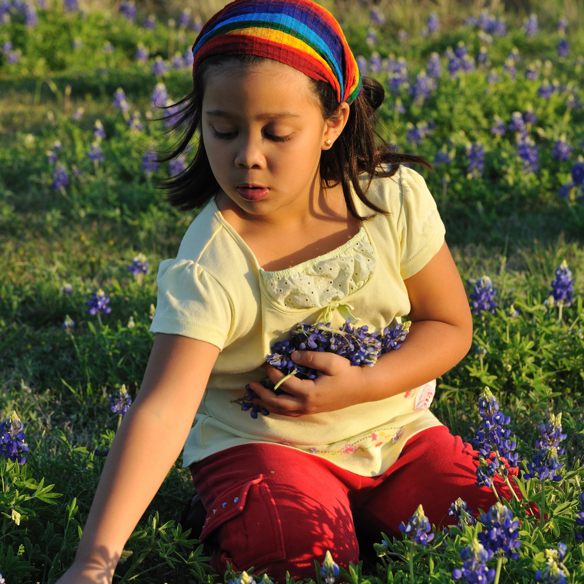 girl picking flowers for mother's day gift guide - The Mockingbird Apothecary & General Store