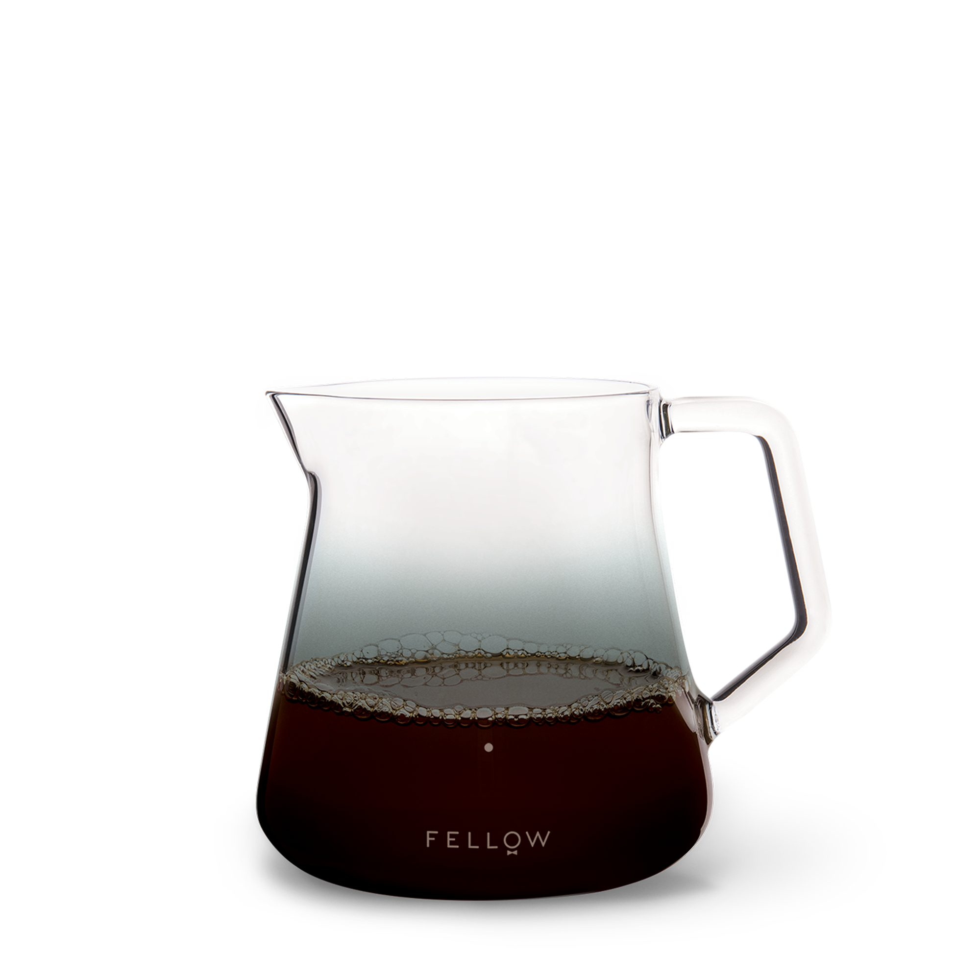 Clear glass coffee pitcher with handle, filled with coffee, on a white background. Brand 'Fellow' visible.