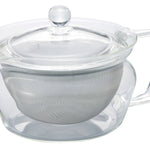 Clear glass teapot with a lid and mesh filter on a white background
