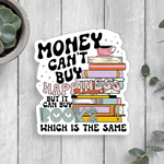 Sticker with motivational quote about books on a wooden surface with plants.