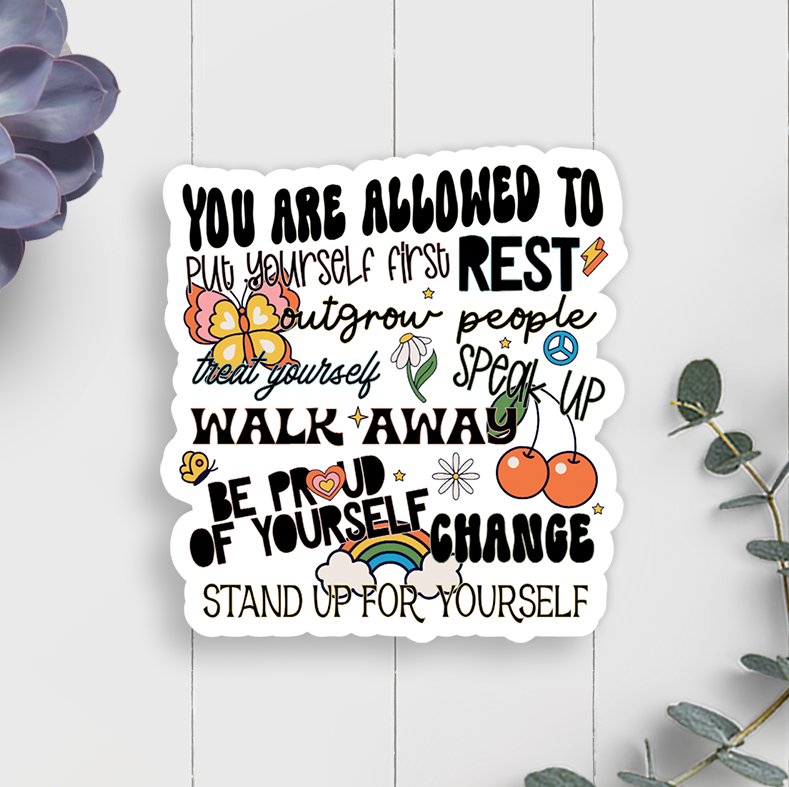 Motivational sticker with affirmations on a white wooden background with decorative elements.