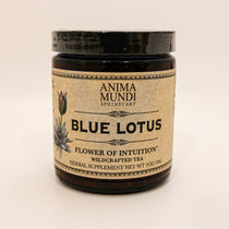 dark jar on white background with "blue lotus" written on brown label