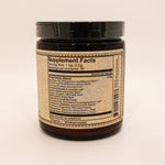 Supplement jar with label on a beige background