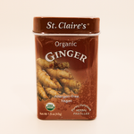 St. Claire's Organic Ginger pastilles packaging on a beige background