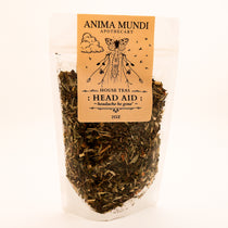 bag of herbal blend of tea with "Head Aid" written on brown label 