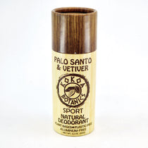 A stick deodorant with a wooden casing, labeled 'Palo Santo & Vetiver Natural Deodorant' by KOKA BOTANICS.