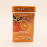 Container of St. Claire's Organic Tangerine Tarts on a beige background