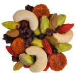 Assorted dried fruits and nuts on a white background