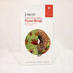 Z Wraps eco-friendly light green floral beeswax food wrap packaging with a bagel illustration on a white background