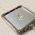 Briolette Draped Over Hand Mirror