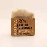 Bar of bug-off tallow soap with a brown cardboard packaging on a beige background