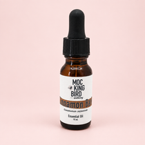 Mockingbird Apothecary Cinnamon Bark essential oil in a 15 mL amber glass bottle with a black dropper cap on a white background.