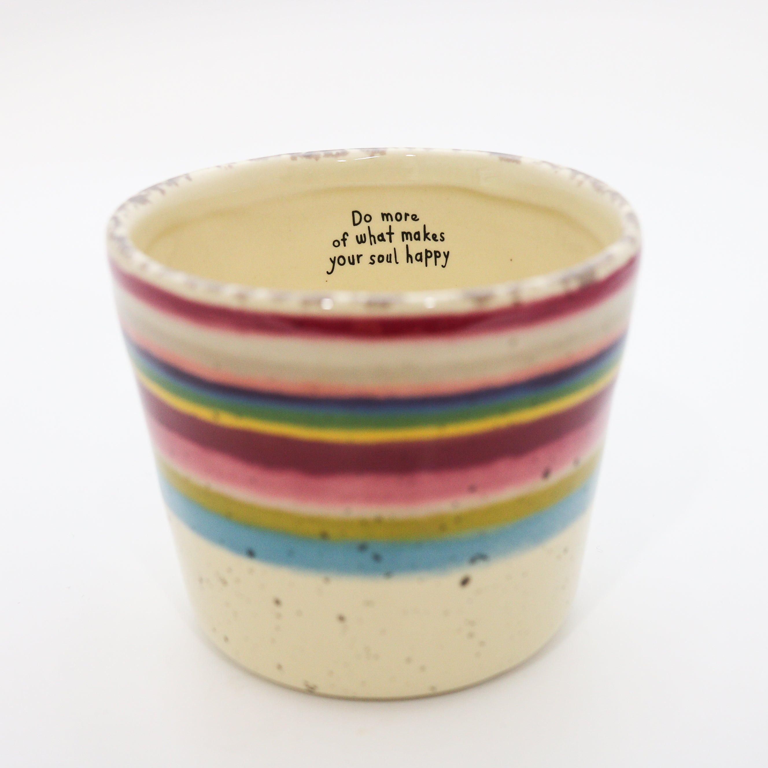 Ceramic cup with rainbow stripes and motivational quote on a white background