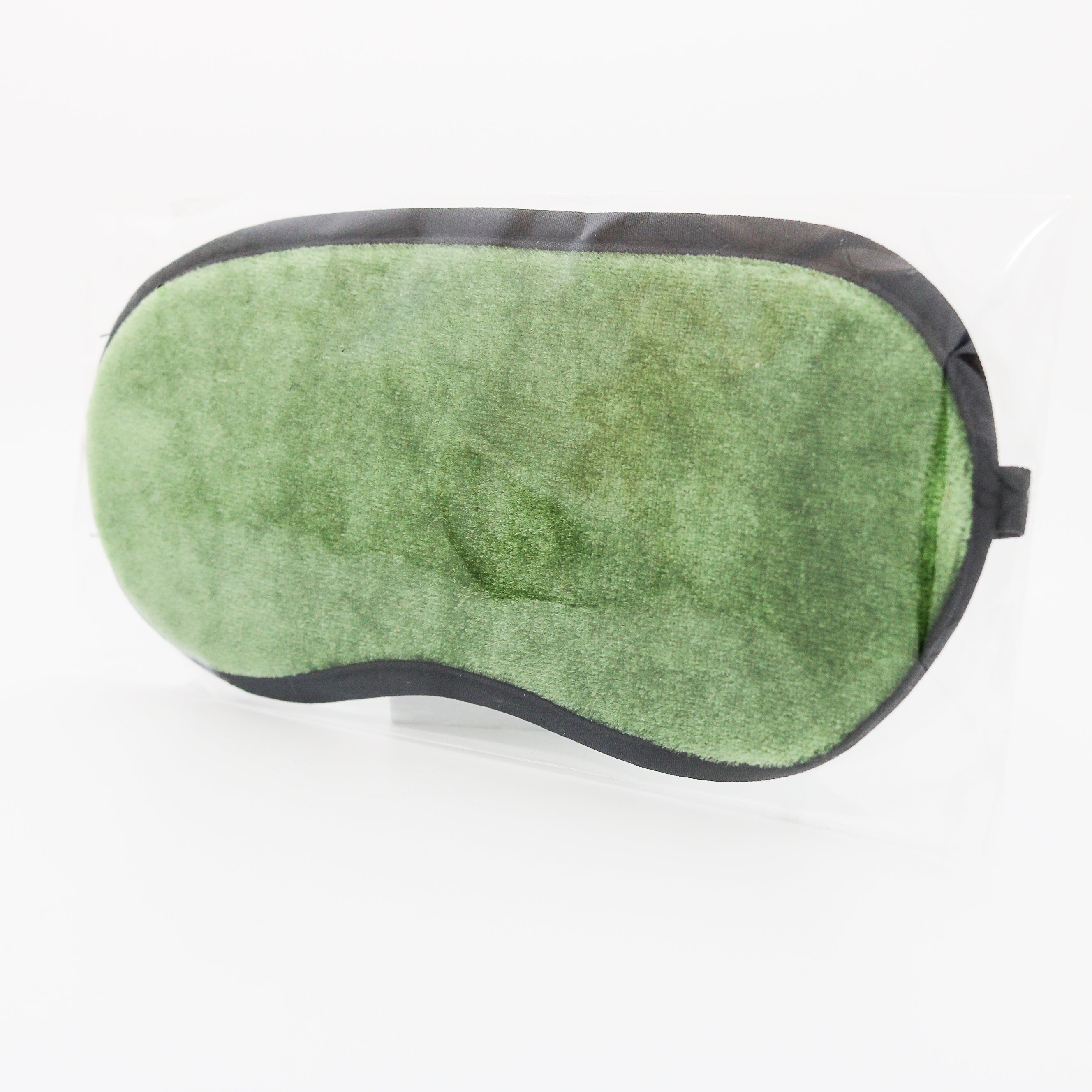 green velour eyemask on white background