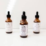 Three bottles of Adiya Parasite Cleanse tincture on a white background