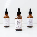 Three bottles of Adiya Mullein Garlic Oil on a white background