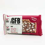 Red and white package of GFB gluten-free oatmeal raisin bar on a white background