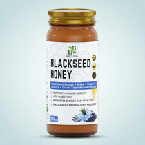 Herb To Body Black Seed Honey jar on pale cool blue background