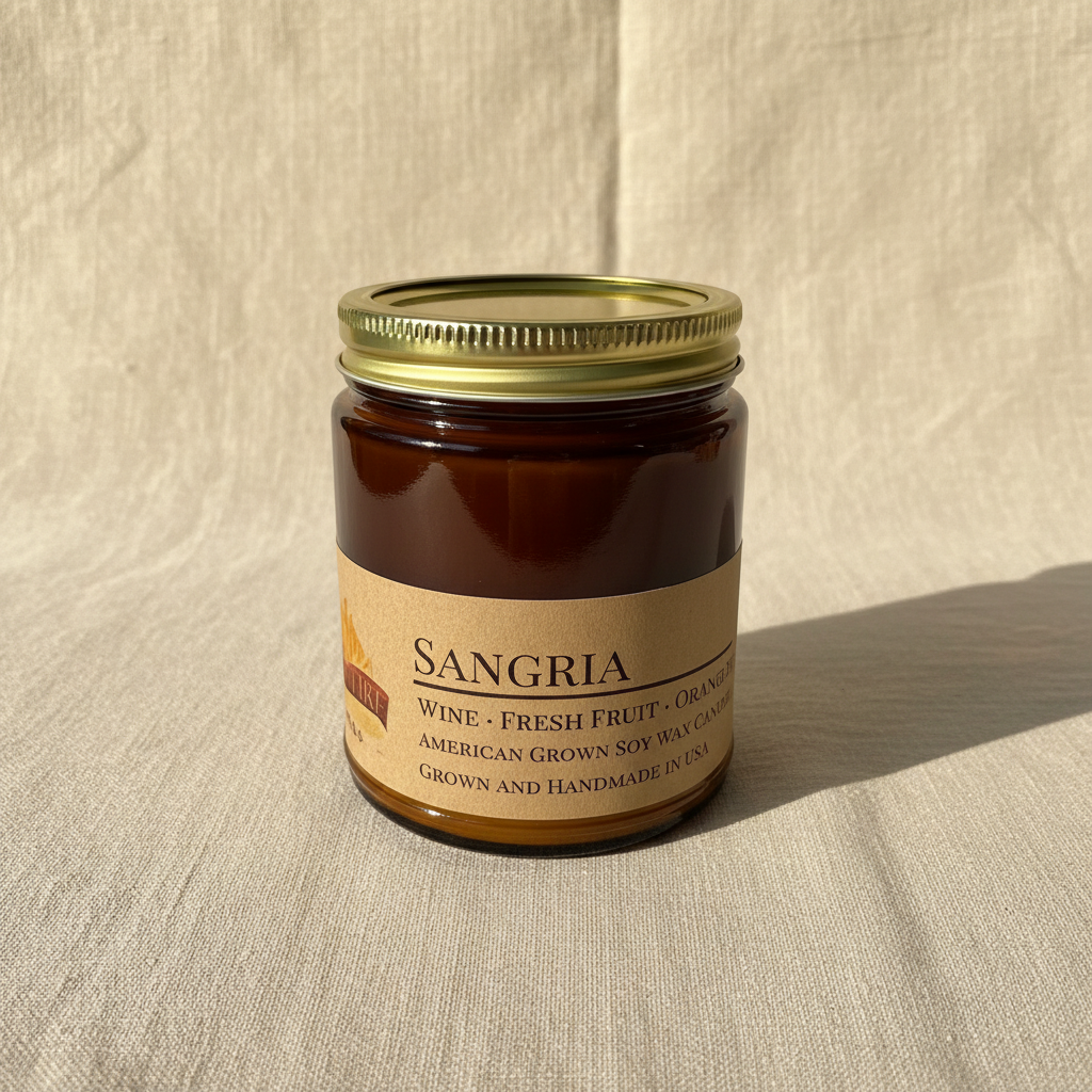Sangria soy candle in amber apothecary jar on warm cream linen background with shadow