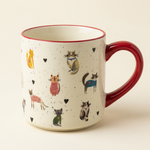 Cat and hearts coffee mug with red handle and rim on a warm ivory background