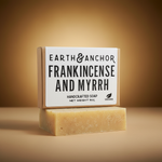 Frankincense and Myrrh vegan bar soap by Earth & Anchor on warm golden amber background