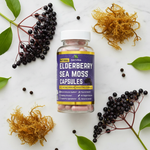 Herb To Body Elderberry Sea Moss Capsules styled with elderberries, sea moss, and peppercorns on marble