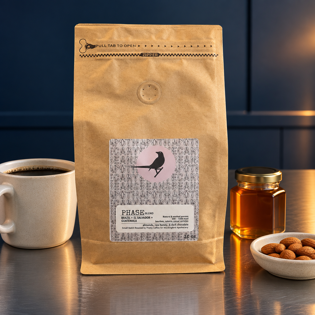 Phase Blend coffee in a midnight blue kitchen scene with a coffee cup, honey jar and almonds