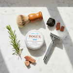 Bogüe Milk Soap No.17 Chiefs Peak Shave Soap – lifestyle flat lay with safety razor, shaving brush, rosemary and cedarwood