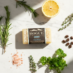 Bogüe Milk Soap No.12 Chefs Blend Goat Milk Bar Soap – lifestyle flat lay with rosemary, thyme, lemon, pink salt and coffee beans
