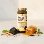 Herb To Body Shilajit Honey styled with shilajit resin, honeycomb, and adaptogens on marble