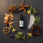 Meditation Essential Oil Blend – flat lay on charcoal linen with vetiver, sandalwood, patchouli, amethyst and mala beads