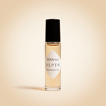 Adia Depth Fragrance Oil rollerball on pale warm amber background