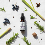 Invigorate Essential Oil Blend – flat lay on crisp white linen with full botanical ingredient spread