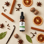Holiday Spice Essential Oil Blend – flat lay on cream linen with full spice ingredient spread