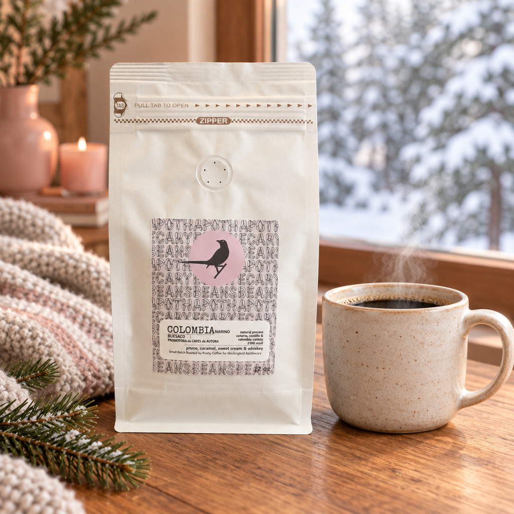 Colombia Nariño coffee with a steaming mug beside a snowy winter window
