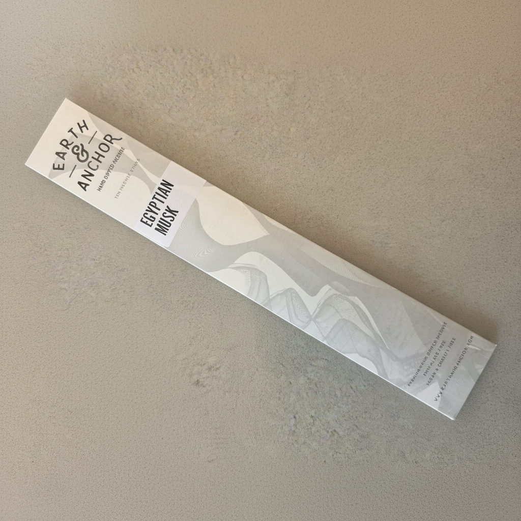 Egyptian Musk incense sleeve by Earth & Anchor on pale sandy taupe background