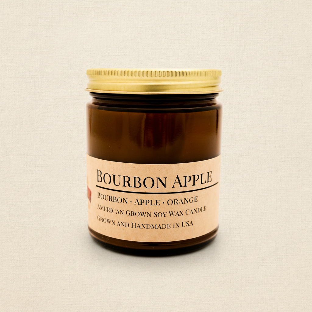 Bourbon Apple soy candle in amber apothecary jar on warm cream linen background with shadow