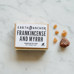 Frankincense and Myrrh soap lifestyle flat lay with frankincense resin tears and myrrh on white marble