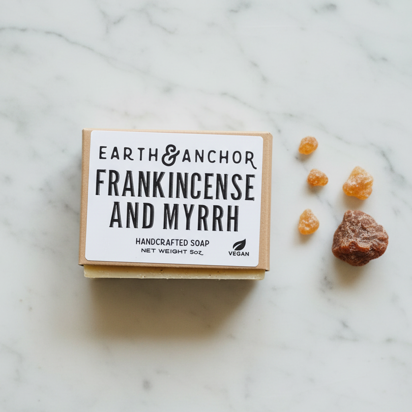 Frankincense and Myrrh soap lifestyle flat lay with frankincense resin tears and myrrh on white marble