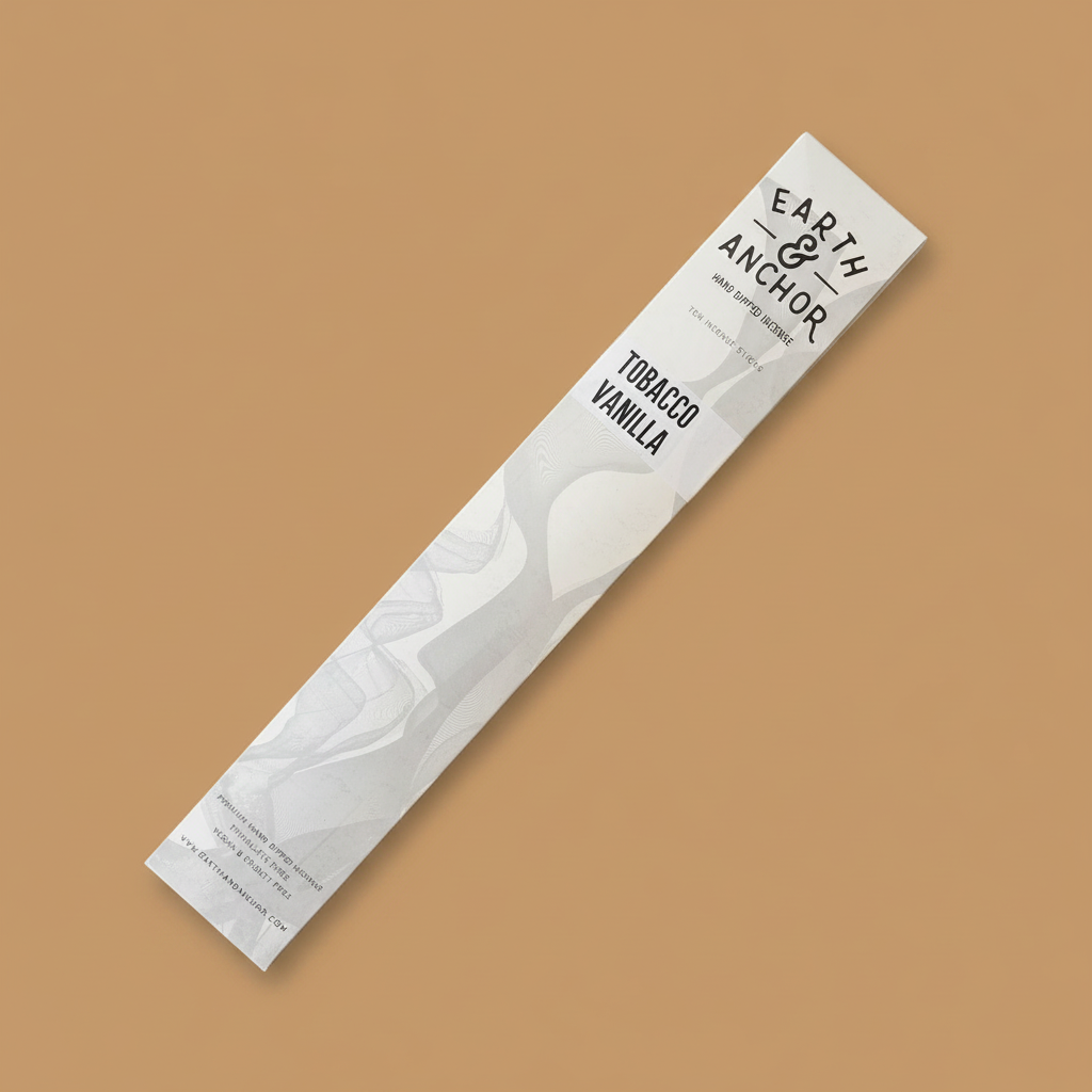 Tobacco Vanilla incense sleeve by Earth & Anchor on warm caramel amber background