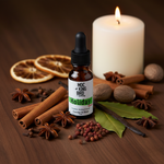Holiday Spice Essential Oil Blend – eclectic editorial on dark walnut with cinnamon, star anise, cloves, vanilla bean and pillar candle