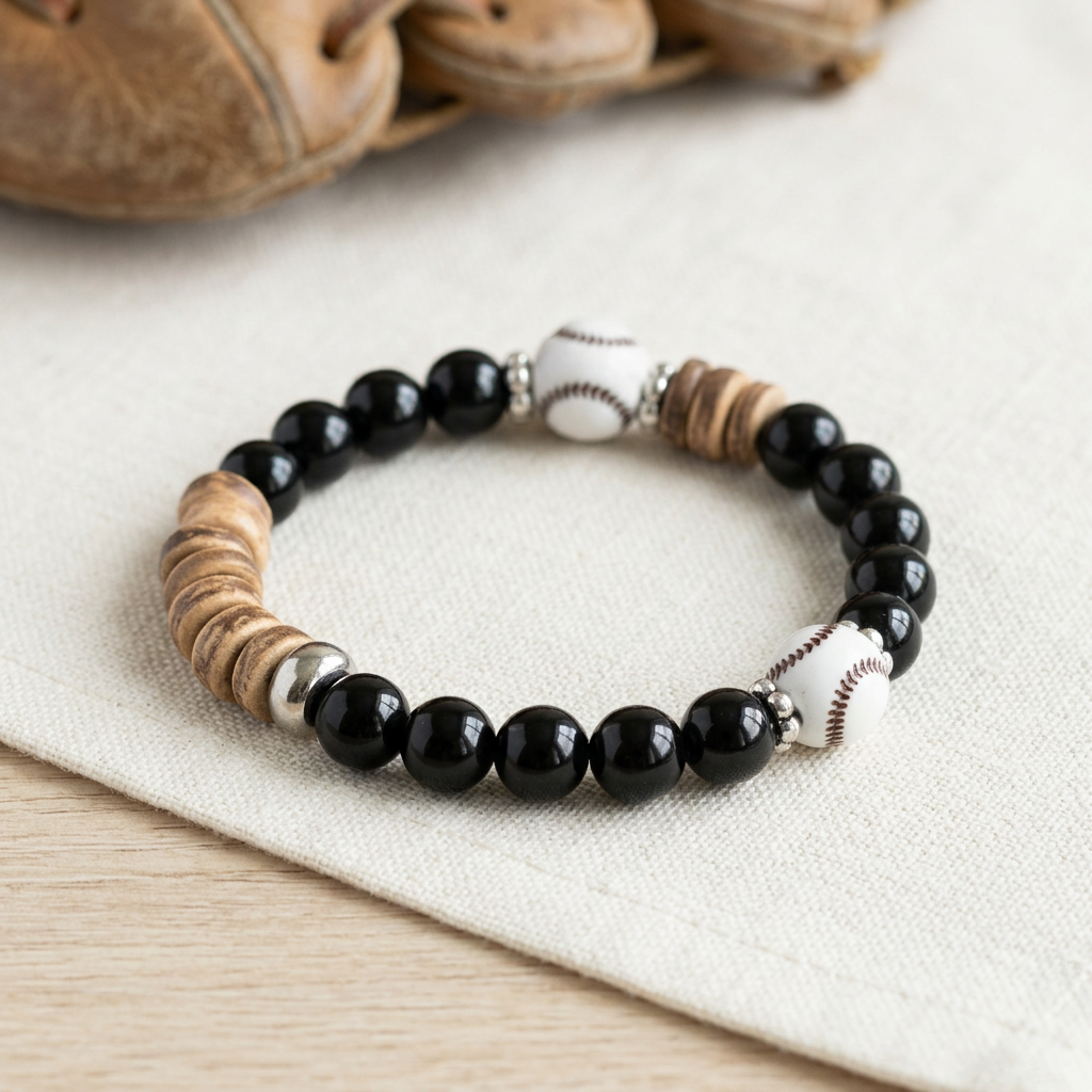 Black beaded baseball bracelet on ivory linen with subtle baseball glove styling