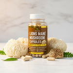 Herb To Body Lion's Mane Mushroom Capsules styled with fresh lion's mane mushrooms and green leaves on marble