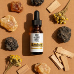 Amber Essential Oil Blend – flat lay on caramel linen with amber resin, benzoin, sandalwood and helichrysum
