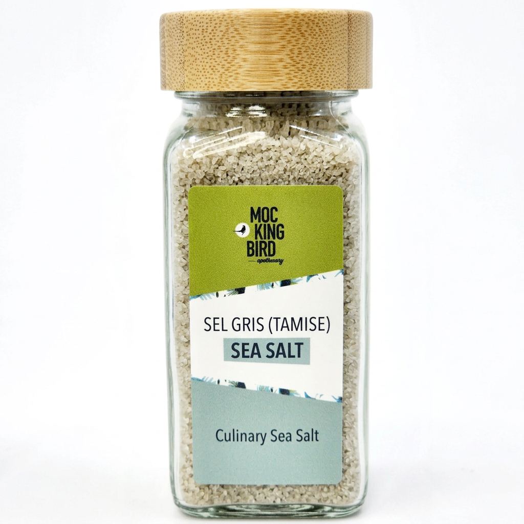 Illustrative Mockingbird Sel Gris (Tamise) sea salt jar with bamboo lid and green, white and pale sage-blue label.