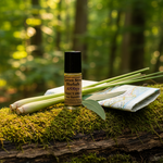 Insect Away Bug Repellent upright on mossy log in lush forest with lemongrass and eucalyptus