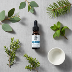 Deep Breath Essential Oil Blend – flat lay overhead on grey linen with eucalyptus, pine, peppermint and cypress