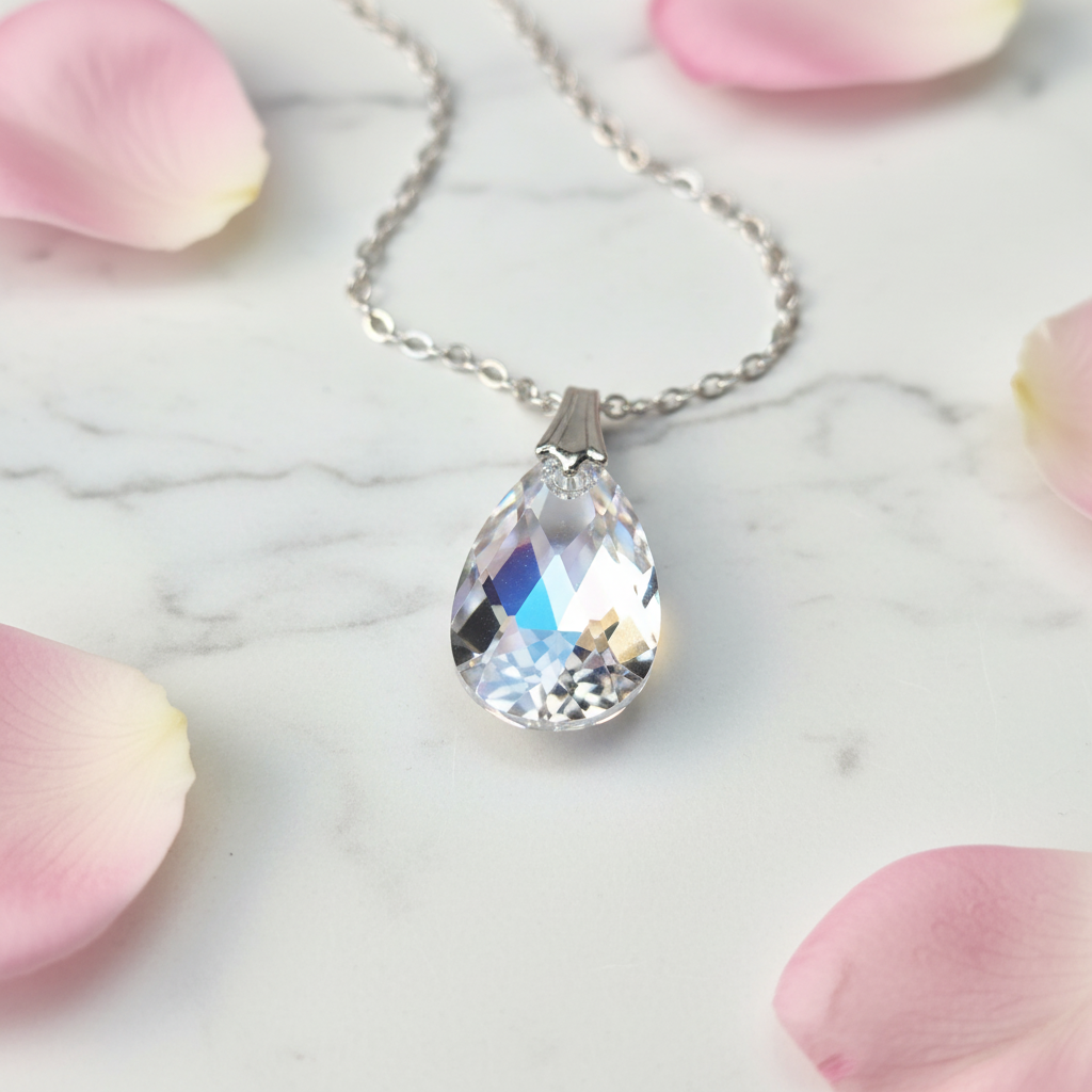 Crystal AB teardrop pendant close-up showing iridescent aurora borealis shimmer