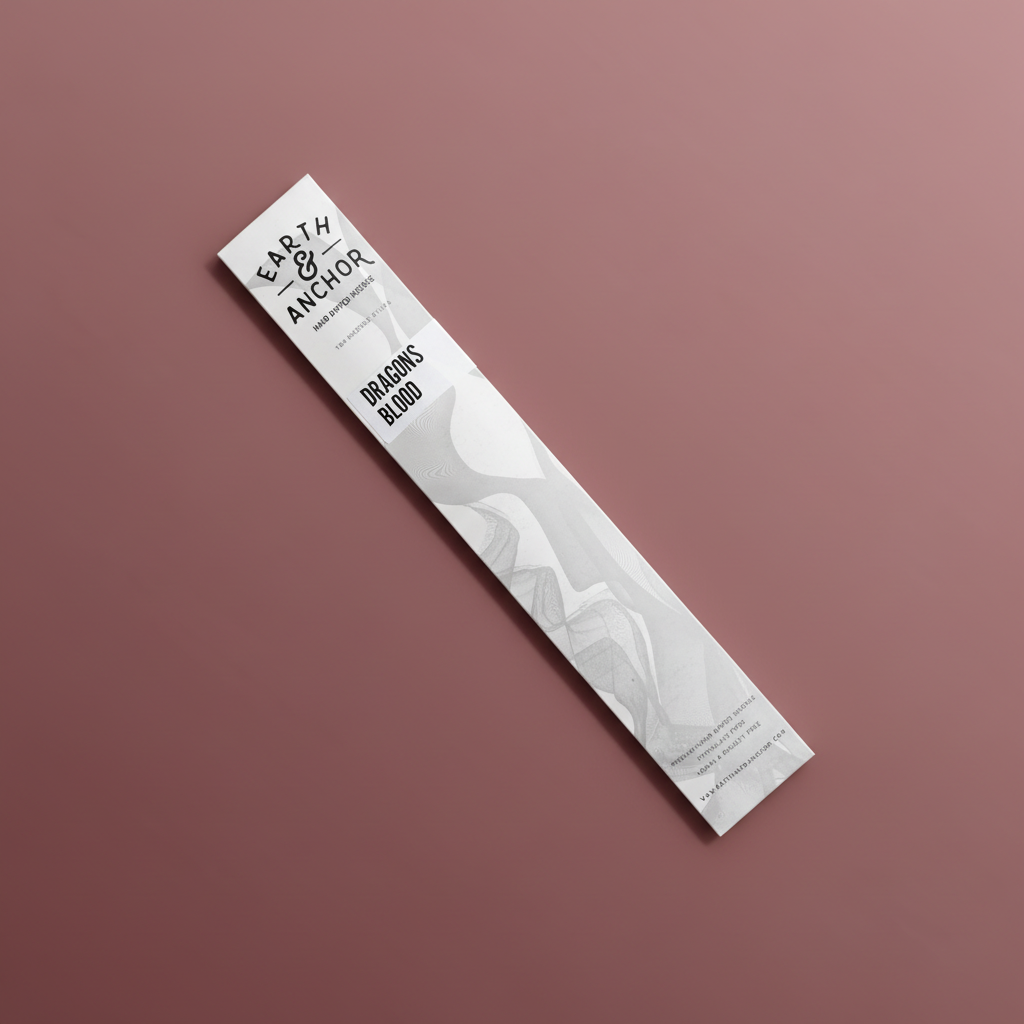 Dragon's Blood incense sleeve by Earth & Anchor on muted burgundy background