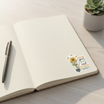 Outgrow Yourself vinyl sticker on an open journal with pen and succulent on a bright wooden desk